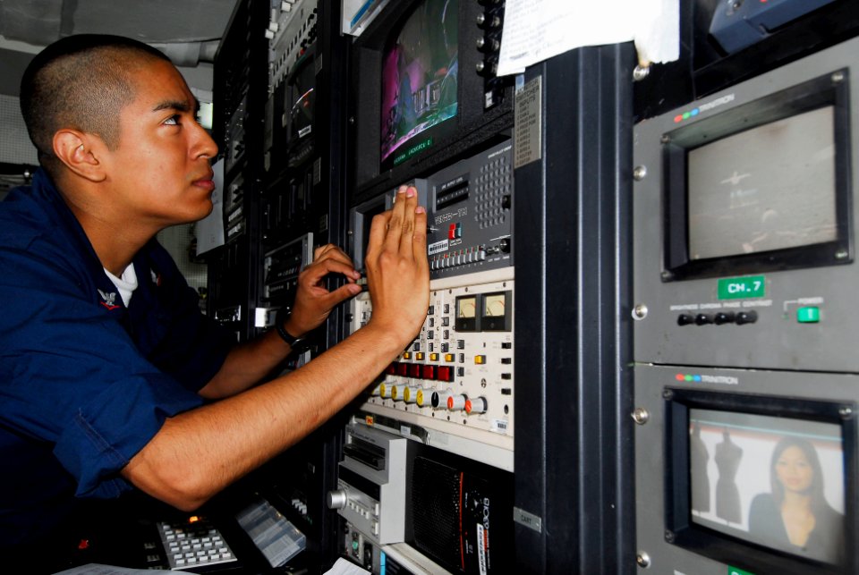 US Navy 080711-N-3946H-070 Interior Communications Electrician 3rd Class Xavier Cuevas, of Woodland Hills, Calif., calibrates a television monitor