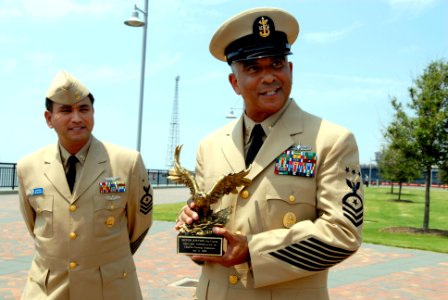US Navy 080711-N-9818V-170 Master Chief Petty Officer of the Navy (MCPON) Joe R. Campa Jr. accepts a memento from Sailors assigned to the aircraft carrier USS Carl Vinson (CVN 70)