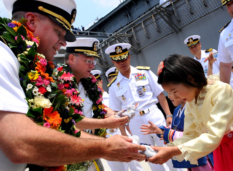 US Navy 080714-N-5961C-005 Rear Adm. Phil Wisecup, commander of Carrier Strike Group Seven, and Capt. Kenneth Norton, commanding officer of the aircraft carrier USS Ronald Reagan (CVN 76), give out
