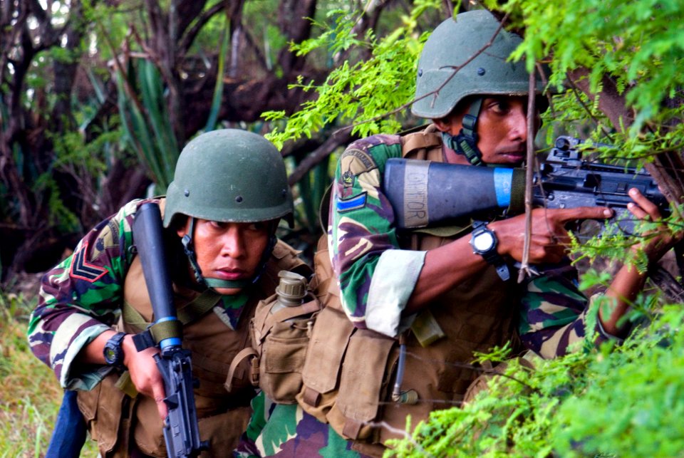 US Navy 080714-N-6674H-185 Indonesian Marines take cover during a beach assault exercise at Pacific Missile Range Facility Barking Sands