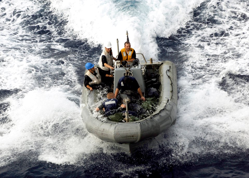 US Navy 080712-N-5681S-088 A rigid hull inflatable boat (RHIB) returns to the multi-purpose amphibious assault ship USS Iwo Jima (LHD 7) during the Iwo Jima Expeditionary Strike Group composite unit training exercise (COMPTUEX)