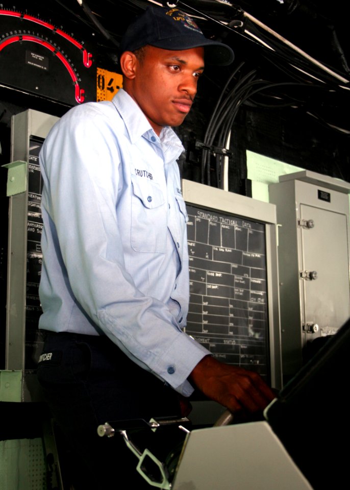 US Navy 080712-N-6764G-563 Seaman Quintan Crutcher steers the amphibious transport dock ship USS San Antonio (LPD 17) during the Iwo Jima Expeditionary Strike Group composite unit training exercise (COMPTUEX)