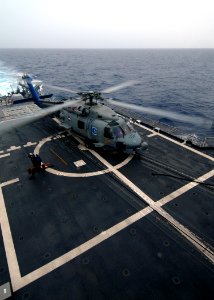 US Navy 080710-N-4236E-172 An SH-60B assigned to Helicopter Anti-Submarine Squadron Light (HSL) 42 prepares to depart the guided-missile cruiser USS Vella Gulf (CG 72) photo