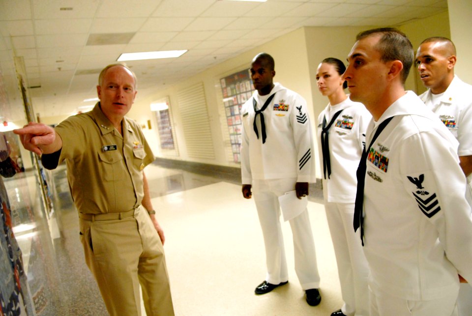 US Navy 080716-N-9818V-078 Vice Adm. John Cotton, Chief of Navy Reserve Commander, Navy Reserve Force shows the Pentagon Quilts on display to Sailor of the Year recipients