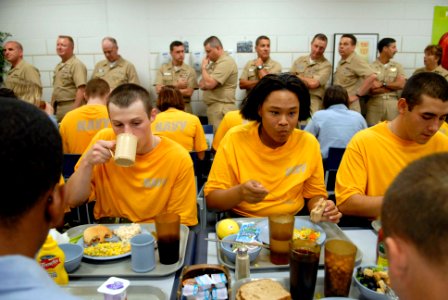 US Navy 080710-N-9818V-092 Master chiefs from Manpower, Personnel, Training and Education (MPT^E) line up for chow where Navy Recruits wear the new Navy Physical Training uniform