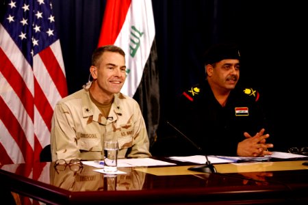 US Navy 080713-N-9623R-001 Rear Adm. Patrick Driscoll, left, spokesman for Multi-National Force-Iraq and Maj. General Abdul Karim Khalaf, spokesman for the Iraqi Ministry of Interior, answer questions during a press conference photo