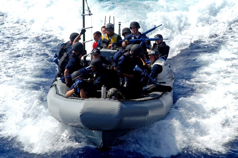 US Navy 080715-N-9123L-001 Sailors assigned to the visit, board, search and seizure team aboard the guided-missile destroyer USS John S. McCain (DDG 56) approach the ship