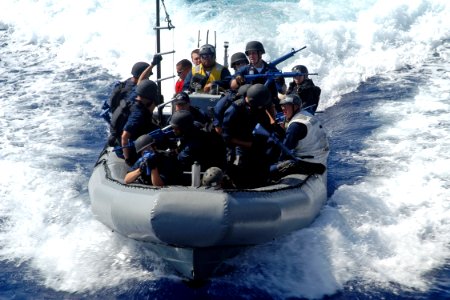 US Navy 080715-N-9123L-001 Sailors assigned to the visit, board, search and seizure team aboard the guided-missile destroyer USS John S. McCain (DDG 56) approach the ship