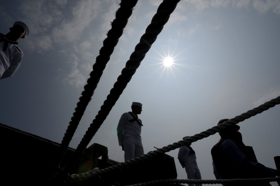 US Navy 080714-N-4009P-632 Sailors man the rails of the Nimitz-class aircraft carrier USS Ronald Reagan (CVN 76) as the ship pulls into Busan for a routine port visit