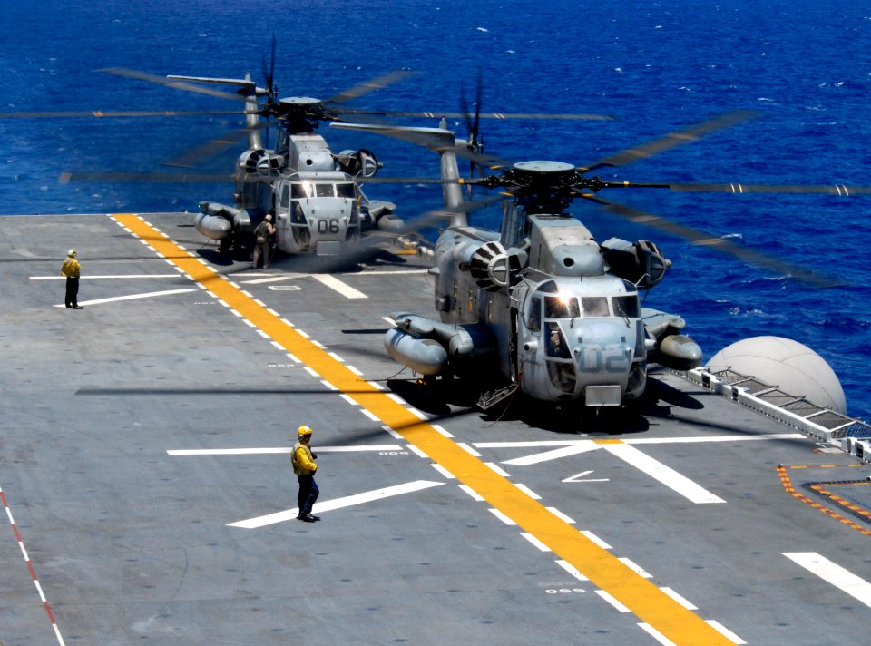 US Navy 080711-N-9500T-132 Two CH-53 Sea Stallions idle on the flight deck of the amphibious assault ship USS Bonhomme Richard (LHD 6)