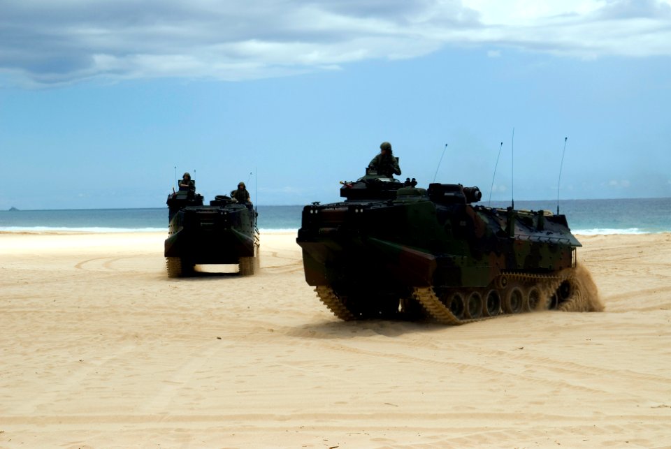US Navy 080714-N-6674H-030 Armored assault vehicles assigned to Combat Assault Company (CAC), 3rd Marine Regiment, perform maneuvers