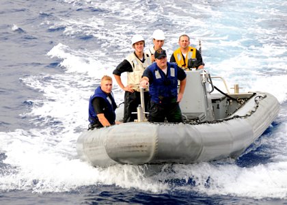 US Navy 080712-N-1082Z-003 Sailors on a rigid hull inflatable boat participating in small boat operations return to the guided-missile destroyer USS Ramage (DDG 61) photo