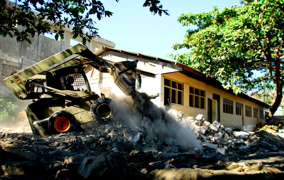 US Navy 080714-N-9689V-006 Sapper Jamie Livingston, assigned to the Australian Army 3rd Combat Engineer Regiment, operates a Bobcat at a Pacific Partnership engineering civic action program