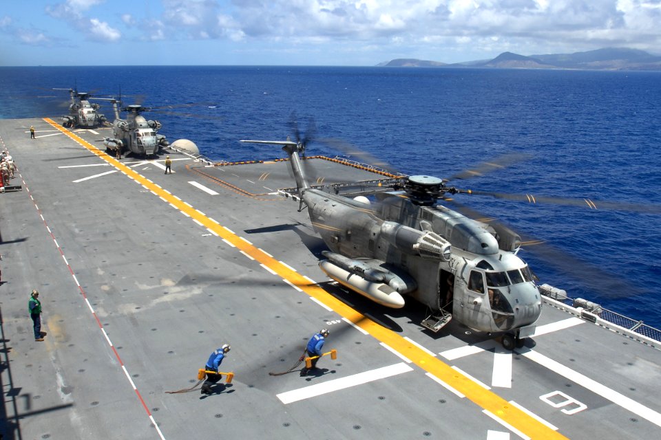 US Navy 080711-N-9500T-279 Sailors aboard the amphibious assault ship USS Bonhomme Richard (LHD 6) approach a CH-53E Sea Stallion