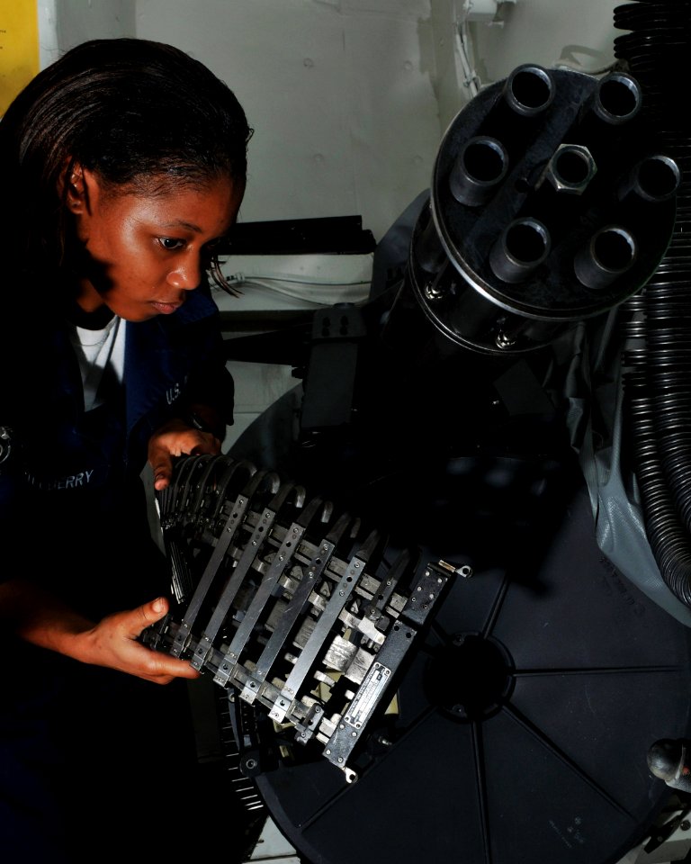US Navy 080714-N-7981E-091 Aviation Ordnanceman Airman Elizabeth Castleberry, from Valdosta, Ga., stows an M61A1 20mm cannon awaiting maintenance aboard the Nimitz-class aircraft carrier USS Abraham Lincoln (CVN 72)