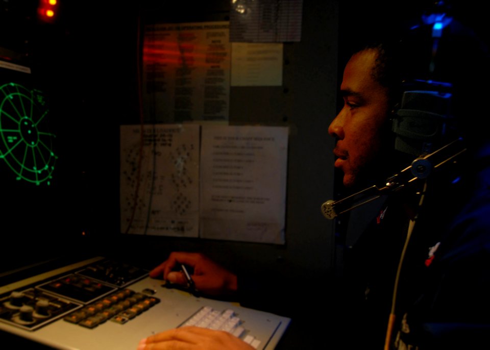 US Navy 080715-N-6999H-022 Cryptologic (Technical) Technician 2nd Class Abdul Thomas searches for threat radars