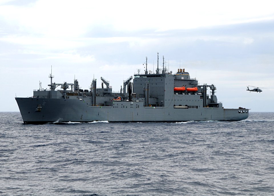 US Navy 080718-N-1082Z-027 The Military Sealift Command dry cargo-ammunition ship USNS Sacagawea (T-AKE 2) steams in the Atlantic Ocean as an MH-60S Seahawk assigned to Helicopter Sea Combat Squadron (HSC) 28