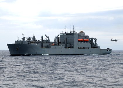US Navy 080718-N-1082Z-027 The Military Sealift Command dry cargo-ammunition ship USNS Sacagawea (T-AKE 2) steams in the Atlantic Ocean as an MH-60S Seahawk assigned to Helicopter Sea Combat Squadron (HSC) 28