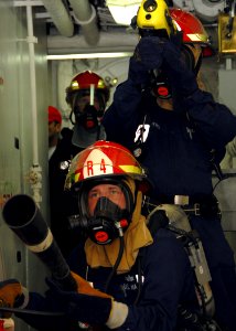 US Navy 080715-N-9134V-085 Sailors simulate firefighting techniques during a general quarters drill aboard the amphibious dock landing ship USS Carter Hall (LSD 50)