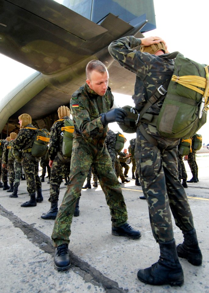 US Navy 080718-N-4044H-025 A German Jumpmaster inspects a Ukrainian paratrooper's parachute pack before his jump during Sea Breeze 2008