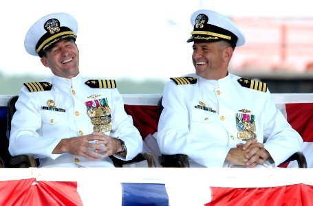 US Navy 080718-N-8467N-004 Capt. Kenneth M. Perry, left, and Captain Robert P. Burke share a laugh during remarks by Rear Adm. Bruce E. Groom at the Submarine Development Squadron 12 change of command ceremony