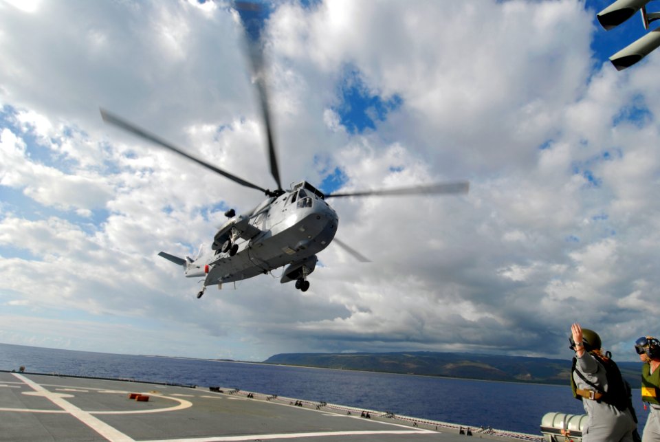 US Navy 080713-N-9671T-126 An RAN SH-3 Sea King takes off from the flight deck of Her Majesty's Australian amphibious ship HMAS Tobruk (LSH 50)