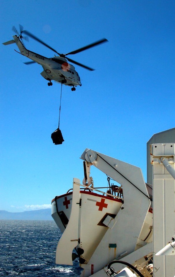 US Navy 080716-N-7498L-186 An AS 332 Super Puma helicopter assigned to the Military Sealift Command combat stores ship USNS Niagara Falls (T-AFS 3) delivers supplies to the Military Sealift Command hospital ship USNS Mercy (T-A