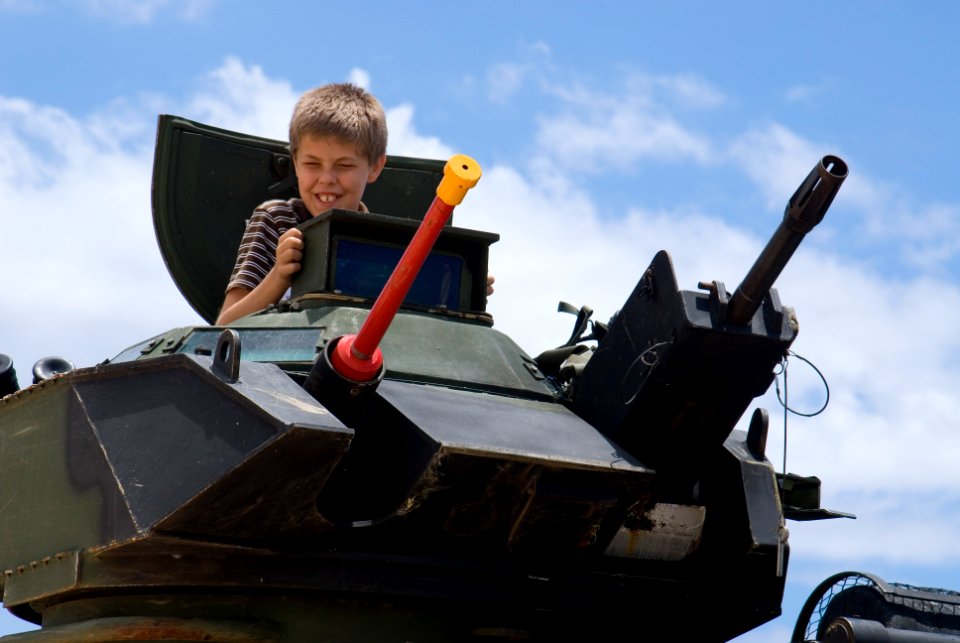 US Navy 080714-N-6674H-048 A child sits in an armored assault vehicle assigned to Combat Assault Company (CAC), 3rd Marine Regiment