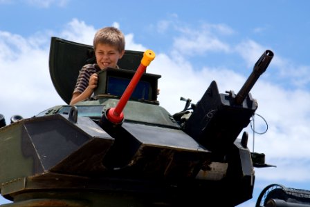 US Navy 080714-N-6674H-048 A child sits in an armored assault vehicle assigned to Combat Assault Company (CAC), 3rd Marine Regiment