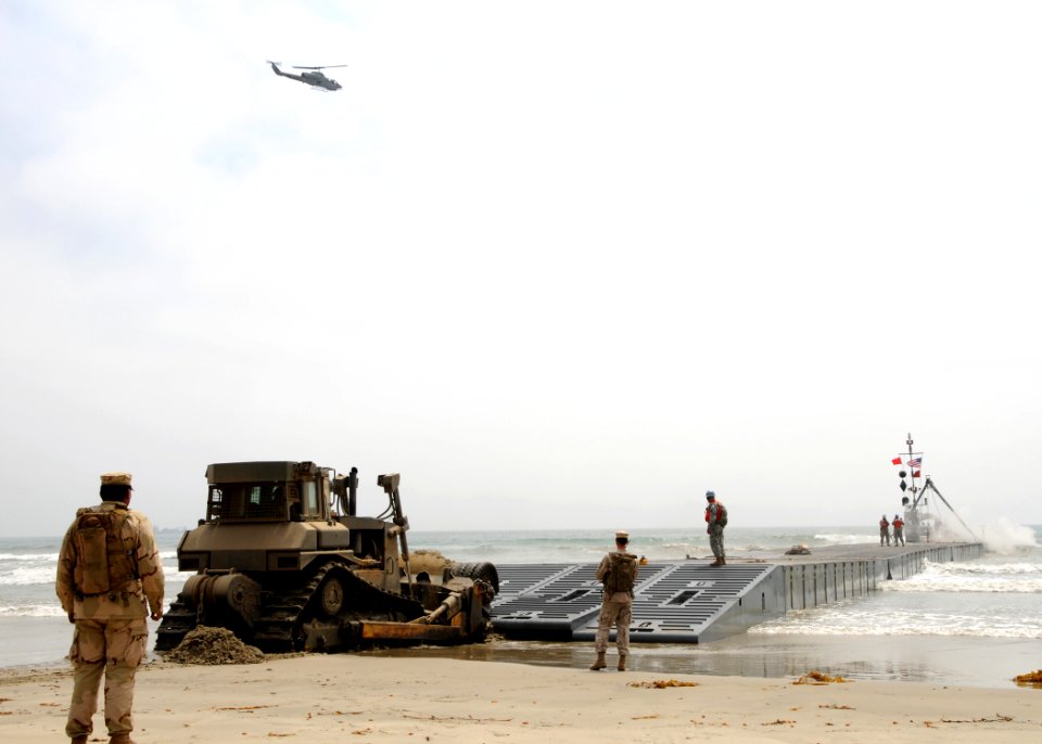 US Navy 080717-N-1424C-860 A Bulldozer pushes an Army lighterage out to sea during Joint Logistics Over-The-Shore (JLOTS) 2008