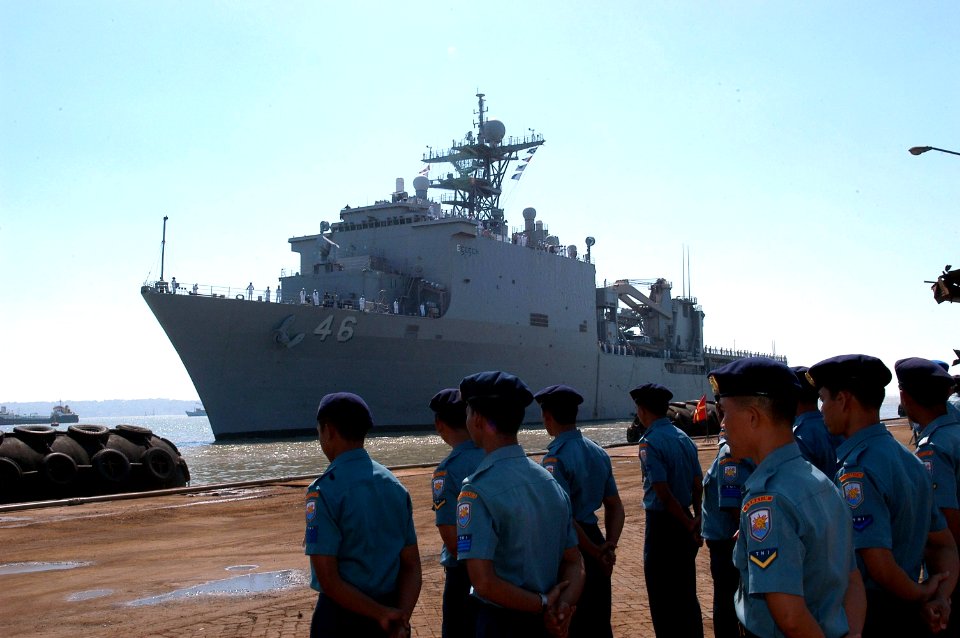 US Navy 080720-N-3446M-026 Members of the Indonesian navy stand pierside as the amphibious dock landing ship USS Tortuga (LSD 46) pulls into port at the Tanjung Perak commercial pier in Surabaya