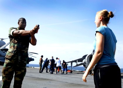 US Navy 080721-N-1082Z-025 Master-at-Arms 2nd Class Rene Tomkin sprays Oleoresin Capsicum spray in the face of Operations Specialist Seaman Melinda Weber