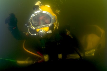 US Navy 080714-N-8298P-057 U.S. Navy Diver 1st Class Nick Holmes returns to the surface with tools used for salvage operations on the sunken former Soviet submarine Juliett 484
