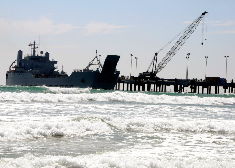 US Navy 080722-N-1424C-672 The Army logistic support ship Gen. Brehon B. Somervell (LSV 3) approaches the surf zone as it comes alongside the elevated causeway system at Red Beach