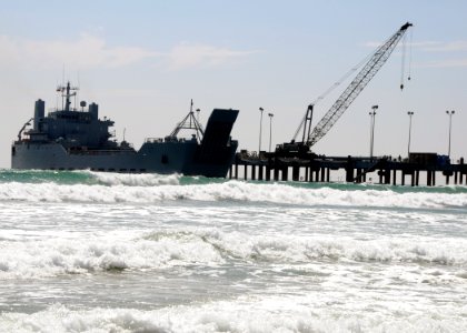 US Navy 080722-N-1424C-672 The Army logistic support ship Gen. Brehon B. Somervell (LSV 3) approaches the surf zone as it comes alongside the elevated causeway system at Red Beach