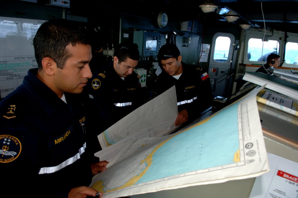 US Navy 080720-N-3931M-004 Bridge watch standers assigned to the Chilean navy frigate CS Riveros (FF18) study navigation charts