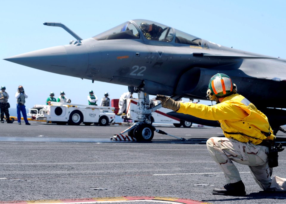 US Navy 080720-N-7571S-011 Lt. Cmdr. Christopher Biggs shoots a French F-2 Rafale off the aircraft carrier USS Theodore Roosevelt (CVN 71) during combined French and American carrier qualifications