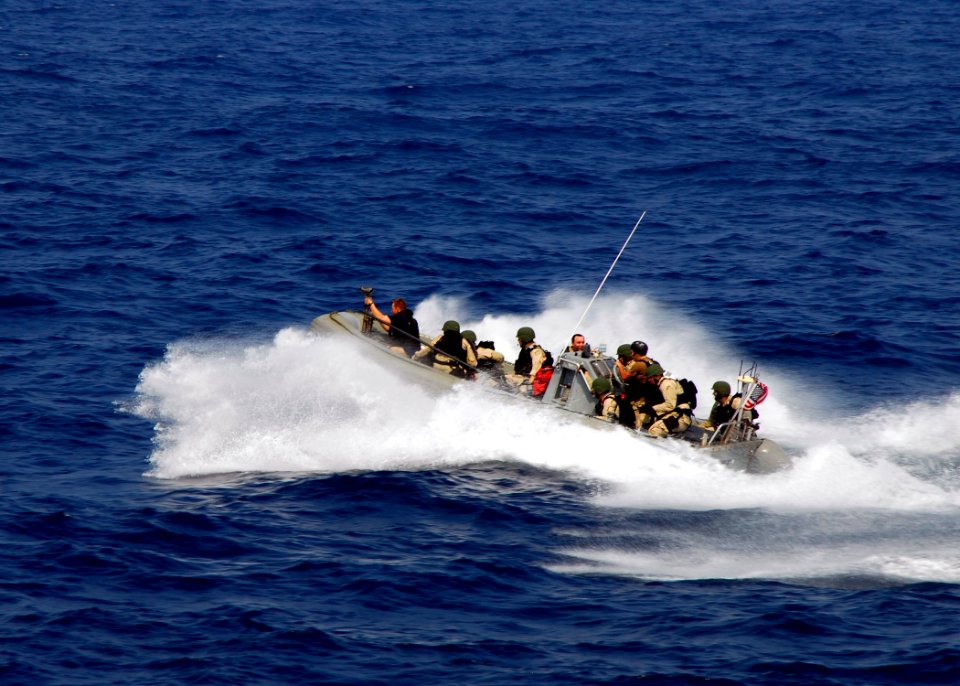US Navy 080721-N-4236E-049 The visit, board, search, and seizure team from the guided-missile cruiser USS Vella Gulf (CG 72), speeds through the water in a rigid hull inflatable boat before conducting a boarding exercises