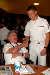 US Navy 080723-N-7975R-001 Culinary Specialist Seaman Apprentice David Worthington, assigned to the Los Angeles-class fast-attack submarine USS Annapolis (SSN 760), meets Navy veteran, Electrician's Mate 3rd Class Gil Fishbec