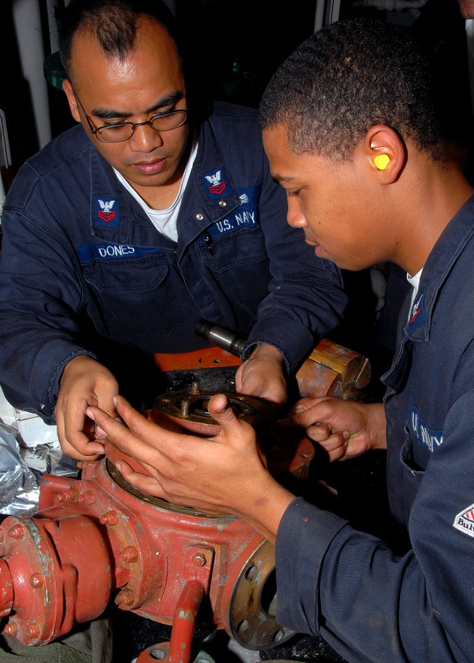 US Navy 080718-N-6999H-039 Machinist's Mates work to rebuild a waste water pump