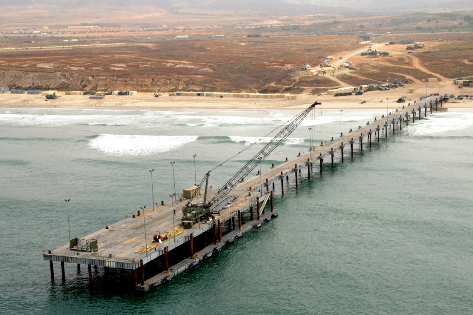 US Navy 080722-N-1424C-474 An elevated causeway system (ELCAS) is at Red Beach with Camp Peguero in the distance during Joint Logistics Over-The-Shore (JLOTS) 2008