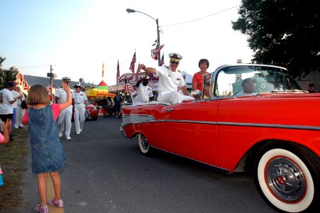 US Navy 080721-N-7975R-005 Rear Adm. Joseph F. Campbell, U.S. Fleet Forces Command, and his wife waves during the Delaware State Fair Parade. Campbell is the co-Grand Marshall of the Armed Forces Day State Fair Parade