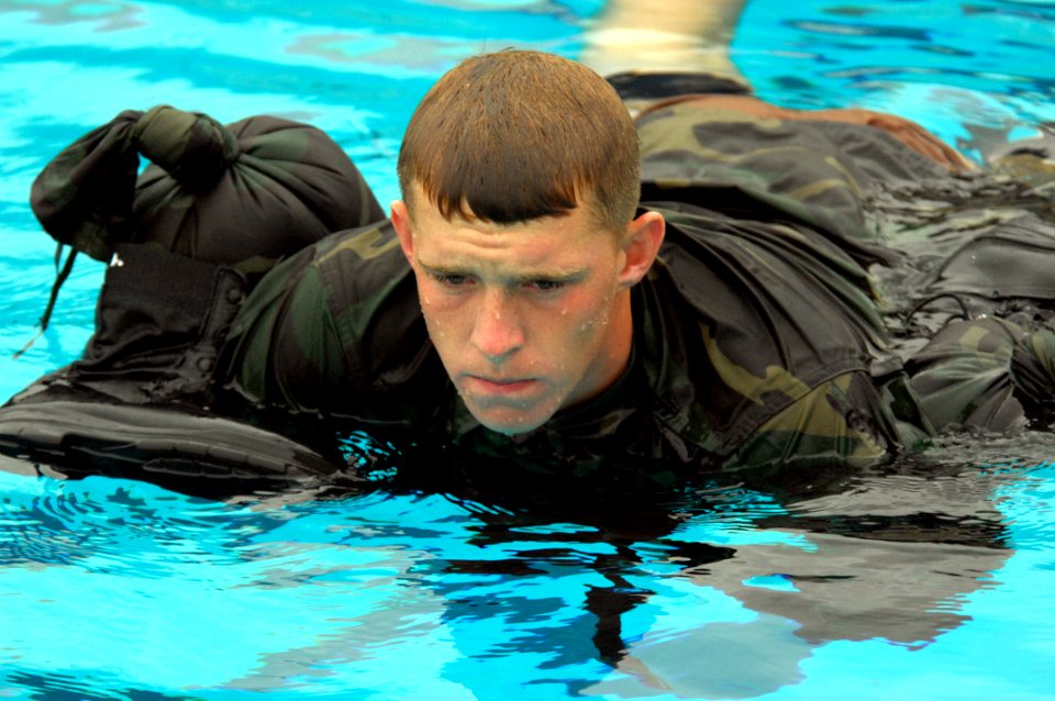 US Navy 080722-N-2959L-127 Seaman Apprentice Damien Bell uses his uniform as a floatation device photo