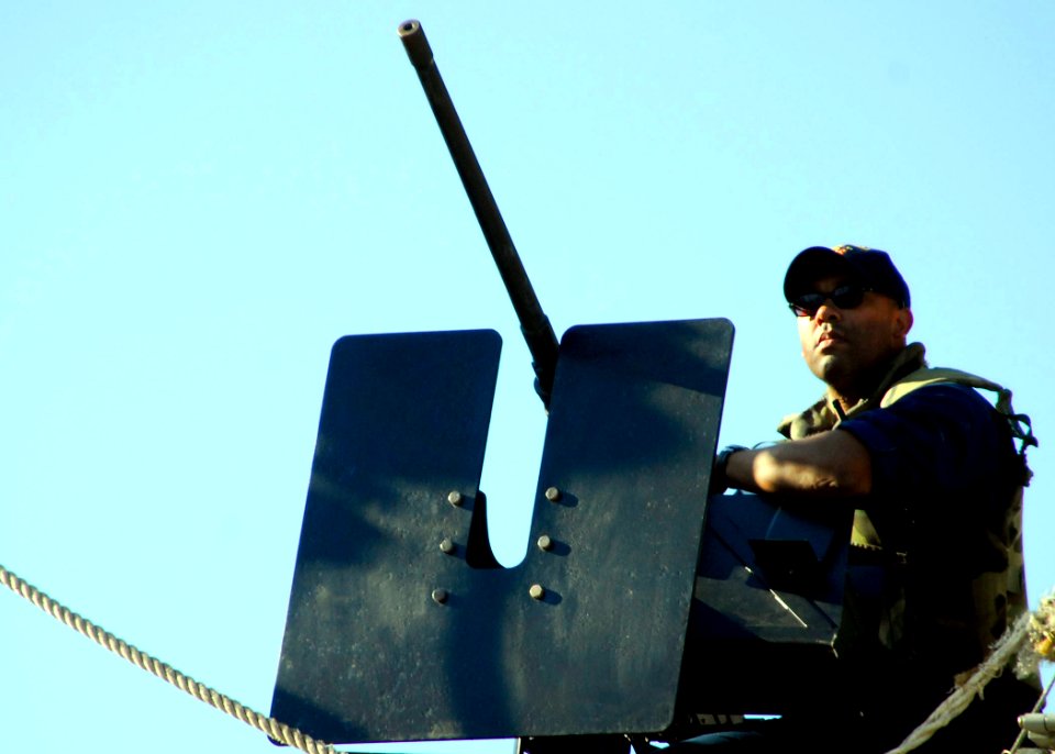 US Navy 080725-N-0780F-004 A Sailor mans a topside security post as the guided-missile destroyer USS Gonzalez (DDG 66) arrives for a routine port visit. Gonzalez has a crew size of 340 and is homeported in Norfolk, Va