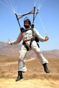 US Navy 080723-N-5366K-001 An explosive ordnance disposal technician flares the canopy of his MT-2XX parachute