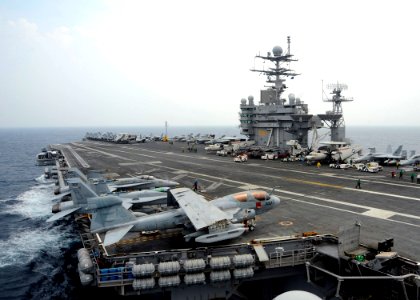 US Navy 080723-N-7571S-005 The aircraft carrier USS Theodore Roosevelt (CVN 71) navigates in the Atlantic Ocean before a French F-2 Rafale M, E-2C Hawkeye and American F-A-18 Super Hornet aircraft fly-by over the deck