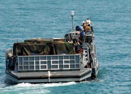 US Navy 080724-N-3392P-020 landing craft utility assigned to Assault Craft Unit (ACU) 2 prepares to offload cargo photo