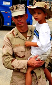 US Navy 080724-N-1688B-060 Chief Steelworker Mike Welch, assigned to Amphibious Construction Battalion (ACB) 2, carries his son to the car