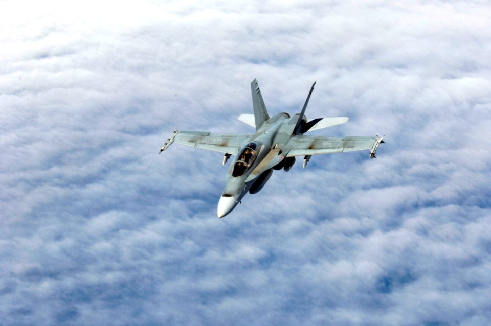 US Navy 080723-N-9500T-129 A CF-18 assigned to Canadian Forces 409 Tactical Fighter Squadron breaks away from taking on fuel