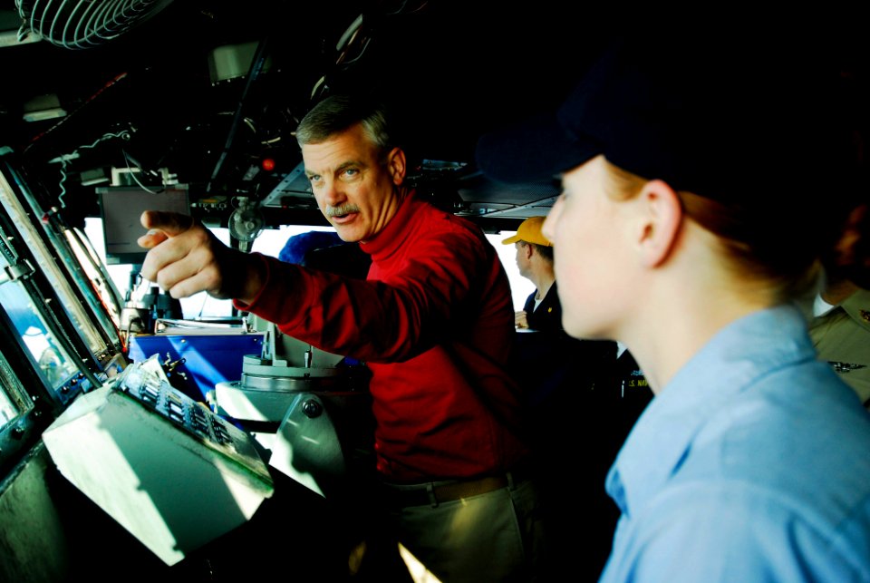 US Navy 080722-N-3946H-039 Capt. Todd Zecchin, commanding officer of the aircraft carrier USS Kitty Hawk (CV 63), explains aircraft recovery to Hospital Corpsman 3rd Class Cassandra Wildey, of Grand Rapids, Mich., on the ship's